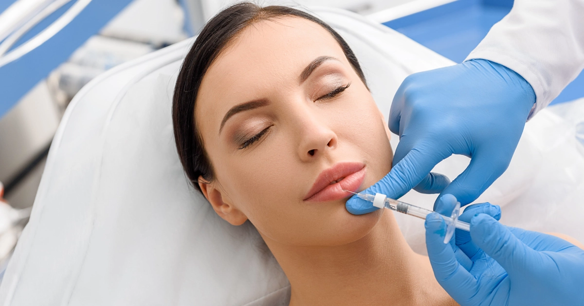 Woman receiving lip Fillers Treatment by professional in Denver, CO clinic